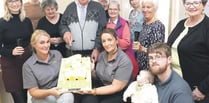 Staff and care users mark first birthday in offices