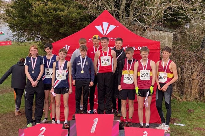 Jack Organ and Joe Murphy (centre podium) helped Powys achieve a team gold.