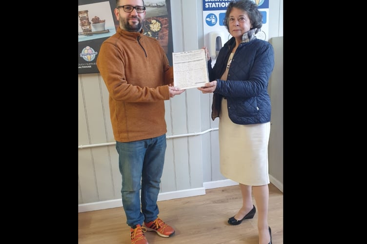 Cllr Rosemarie Harris, receives the ‘Say Yes to Llanigon Green Space Petition’ from Gwernyfed Community Councillor and campaigner, William Lloyd