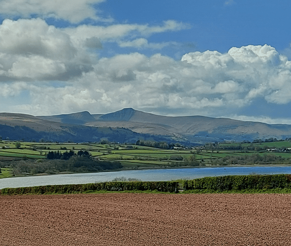 The Brecon Beacons overlooking Llangorse Lake.