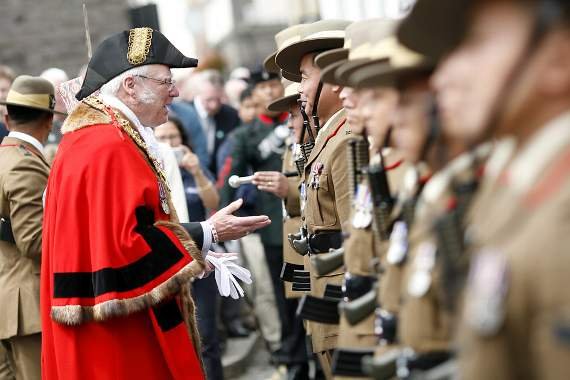 Former mayor Ieuan Williams inspecting the Gurkha soldiers in the parade in 2017