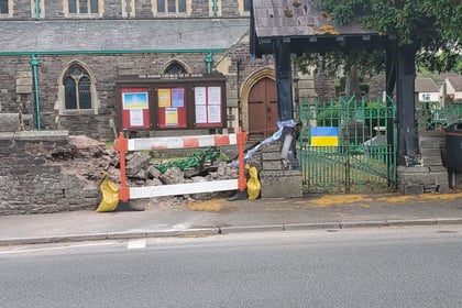 Woman in hospital after collision with Brecon churchyard 