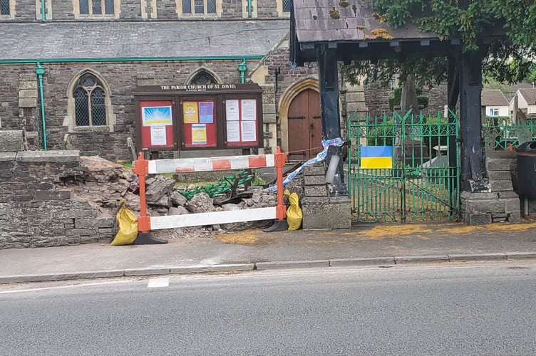 The aftermath of a crash between Llanfaes church and a car