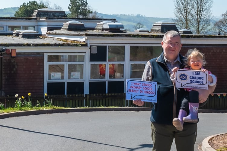 Cllr Iain McIntosh campaigning in front of Cradoc School