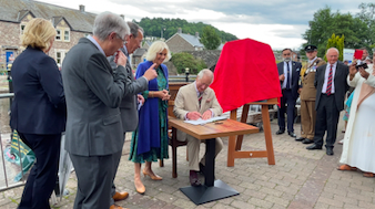 Why did King Charles and Queen Camilla visit Theatr Brycheiniog? 