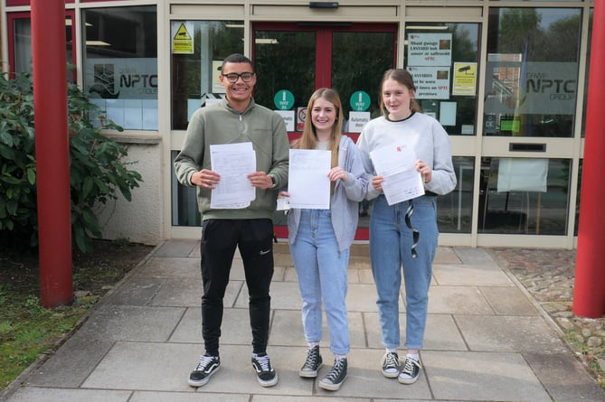 Left to right, learners James Vaughan, Nicole Davies and Laura Griffiths celebrate their results and the start of their degrees.