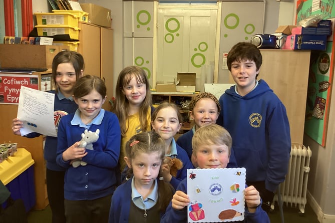 Members of the school's EcoCouncil Committee at Ysgol Pontsenni with the letter