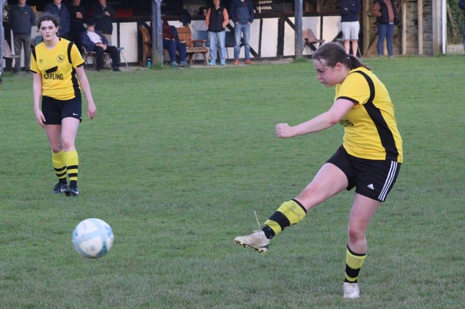 Captain Gemma Bradford hammers home a penalty for Penybont 