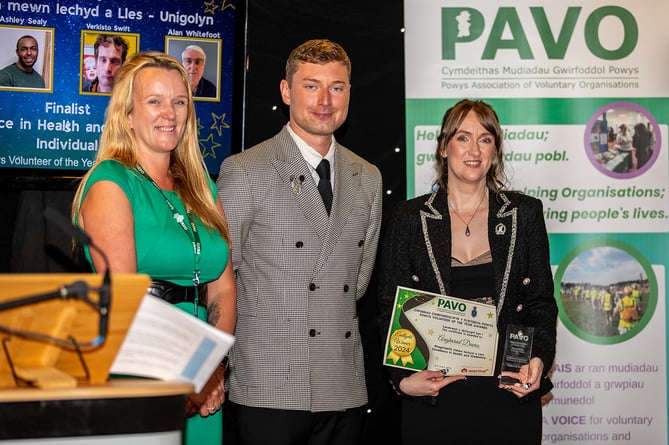 Claire Swales, PAVO CEO, and Jamie Burt, PAVO Chair of Trustees, with Angharad Davies, Excellence in Health and Wellbeing Award winner.