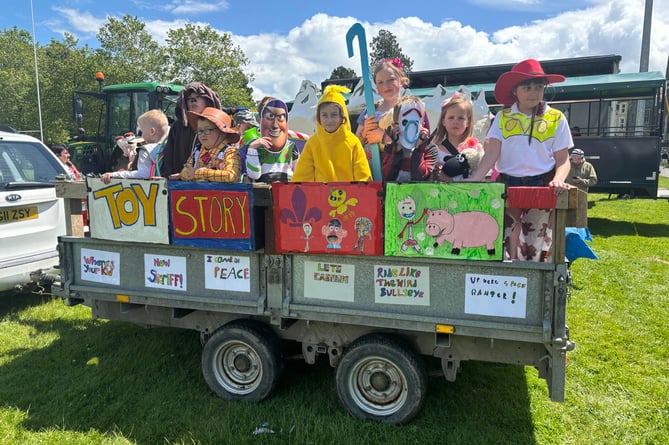 Toy Story came to life to the Cubs and Scouts float