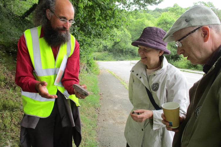 Joe Botting explaining the rocks at Llandrindod Lake to Janice and Gareth Spencer