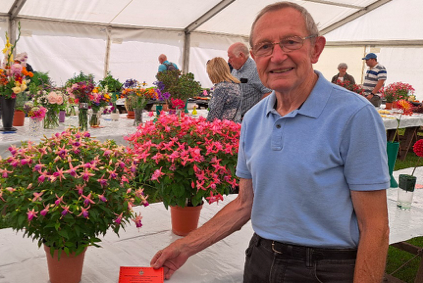 Mr Gareth Davies with his fine display of fuchsias