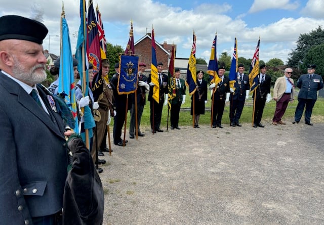 Piper and standards at St Martin's, Hereford