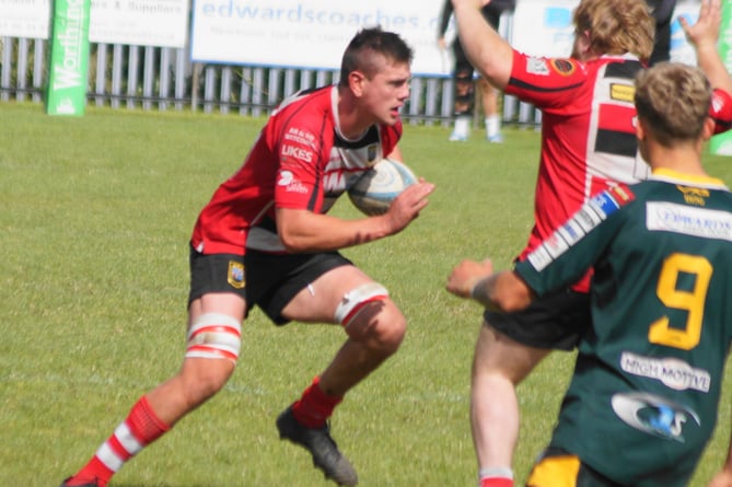 Callum Bradbury drives through the gain line.