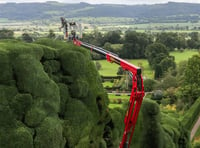 Gardener uses cherry picker to trim castle's 300-year-old hedges