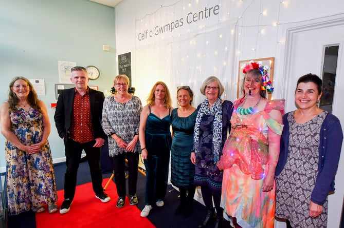 A group of staff members from Celf o Gwmpas, who served prosecco to guests on arrival