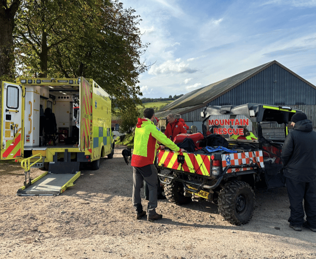 Mountain rescue team assists injured walker