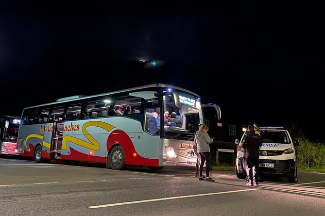 The two rail replacement coaches waiting at Dolfach to take passengers from the wreckage to their final destinations. 