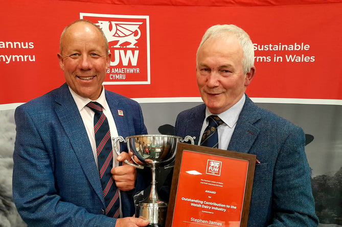 FUW President Ian Rickman (left) presents Stephen James with his award.