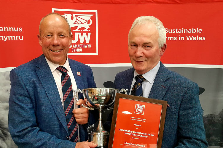 FUW President Ian Rickman (left) presents Stephen James with his award.