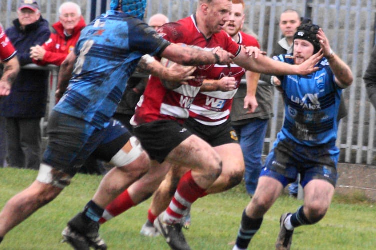 Jack Dixon breaks through a tight Bargoed defence