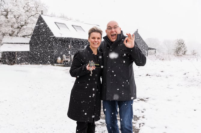 *Embargo 8:00am Friday 21//11/2024*

Omaze winners Sarah & Richard Perry outside their new house in Wales. Photo released November 22 2024. A lucky Welsh mum has won a stunning country home worth Â£500K - near her family in Wales.Sarah Perry, 49, is now the proud owner of a contemporary three-bedroom, two bathroom home in Powys.Her stunning property is located near where her family still live - and she found out she'd won on the way to visit them.Sarah, originally from Llanfair Caereinion, has won the Omaze Great Escape House Draw, Wales, as well as along with Â£50,000 in cash - for just Â£30.