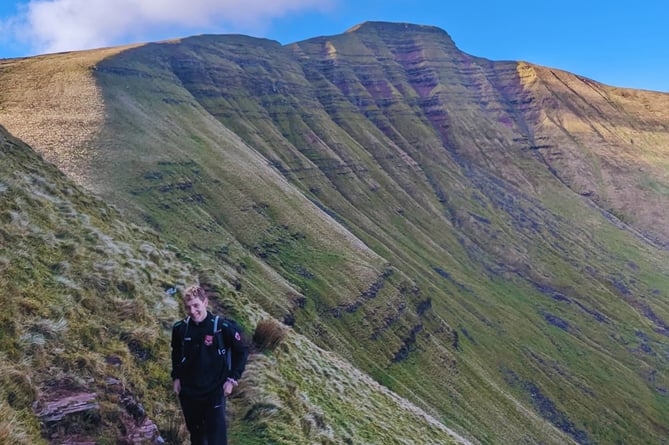 Pupil Ieuan Thomas hiking in the mountains