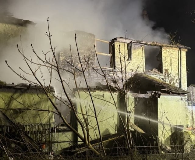 Roof and wall collapse in early morning house fire