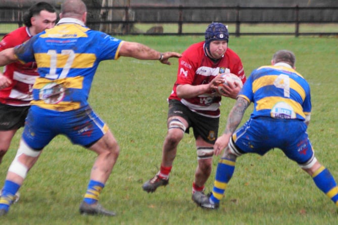 Athletic Iwan Davies drives into contact