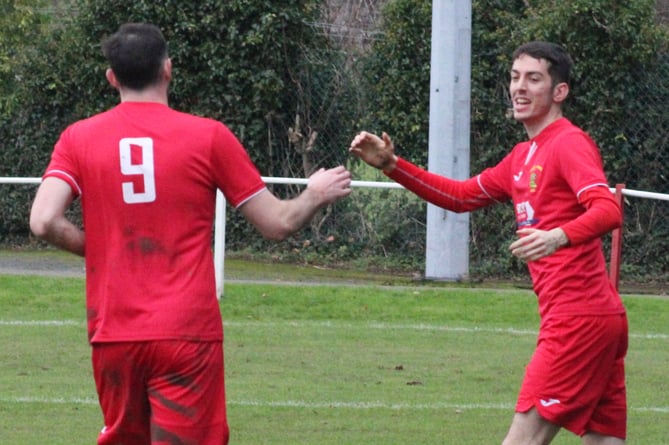 Joel and Craig Evans celebrate a goal