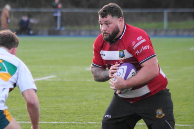 Chris Phillips carries hard at the Merthyr defence