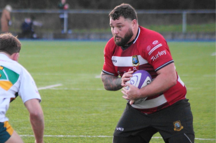 Chris Phillips carries hard at the Merthyr defence