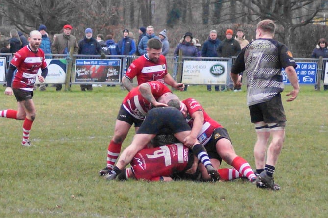 Brecon's Lewis Jones weighs up his options at a ruck           