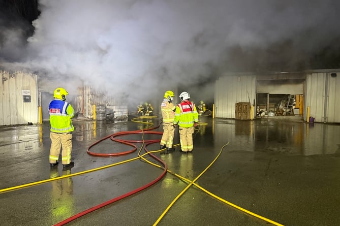 Fire crews are tackling a fire at an industrial estate in Welshpool