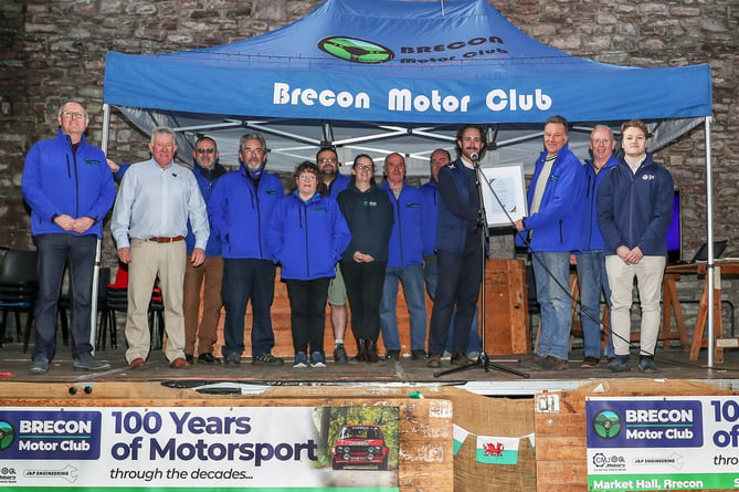 Brecon Motor Club Chairperson, Malcolm Rich, receives the presentation certificate from Ben Cross of Motorsport UK