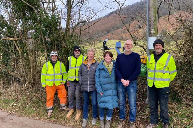 Members of the Dyffryn Broadband Association community group with Broadband 4 Wales Limited