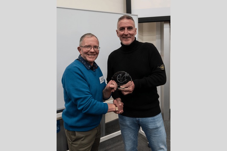 Andrew King, left, receiving his Lifetime Achievement Award from the Welsh Ornithological Society President and S4C/BBC presenter, Iolo Williams