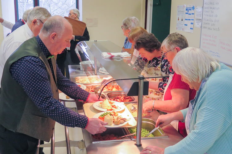 Rotarians preparing to serve the meals