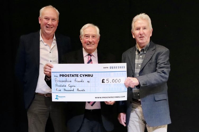 Gerwyn Rees and Terry Eckley presenting the cheque to Sir Gareth Edwards