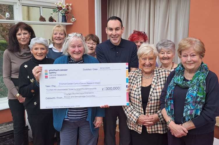 Cancer Research Wales Brecon and Sennybridge Committee with Adam Fletcher and the £300,000 cheque