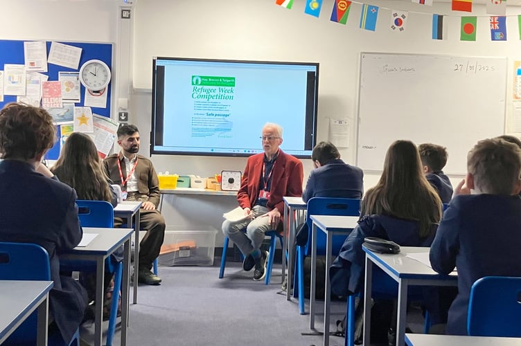 Hawkar and Rowland Jepson speaking to a class in Brecon High School