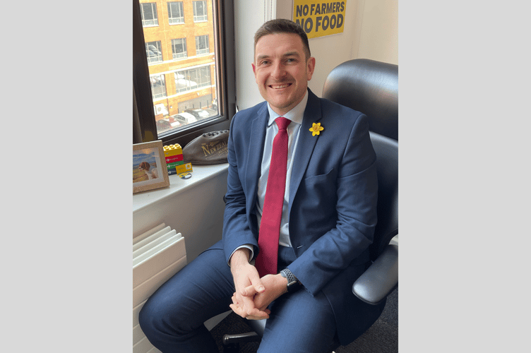 James Evans wearing a Marie Curie Daffodil