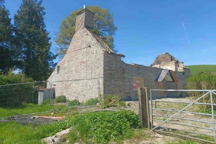 The burnt down Glan yr Afon farmhouse. Plans to demolish the building and build a new farmhouse have been approved by Powys planners. 