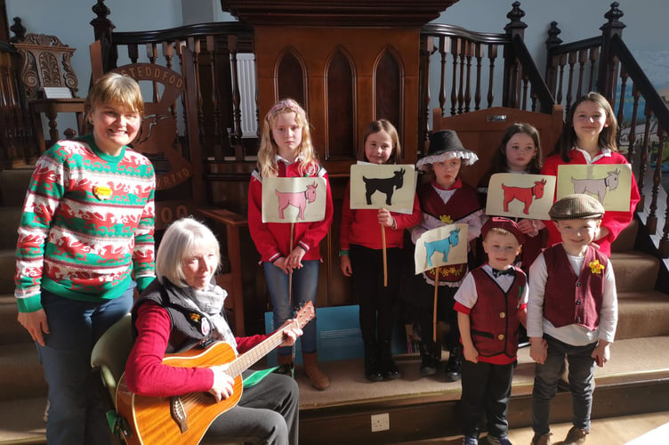 Local children singing with Heather Davies and Sarah Jones