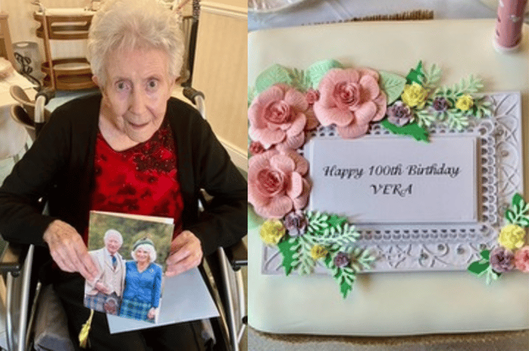 Vera with her birthday card from the King and Queen, alongside her birthday cake